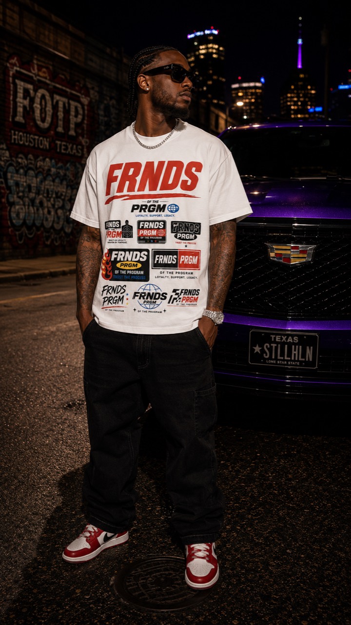 Model wearing the white FRNDS PRGM tee beside a purple Cadillac at night