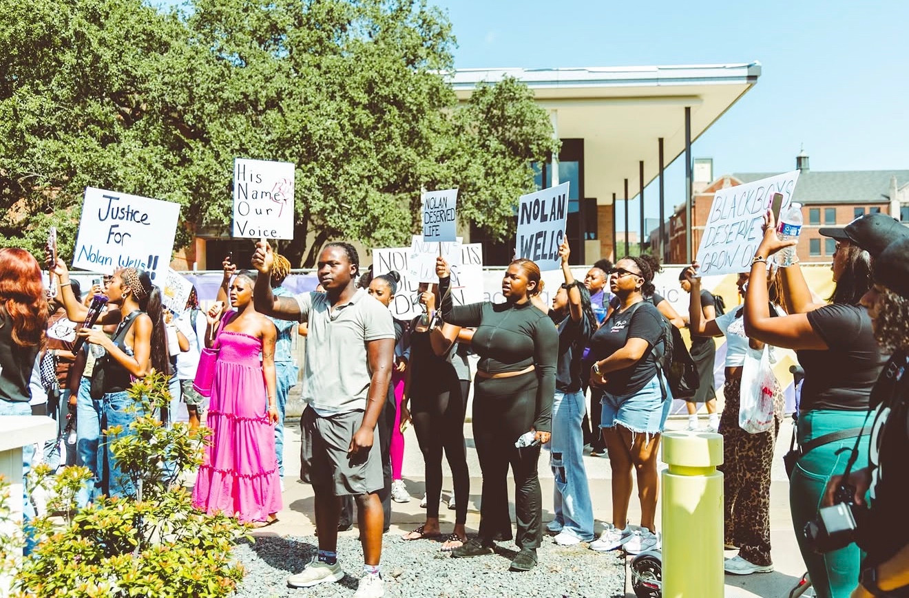 Prairie View rally participants holding signs for Nolan Wells